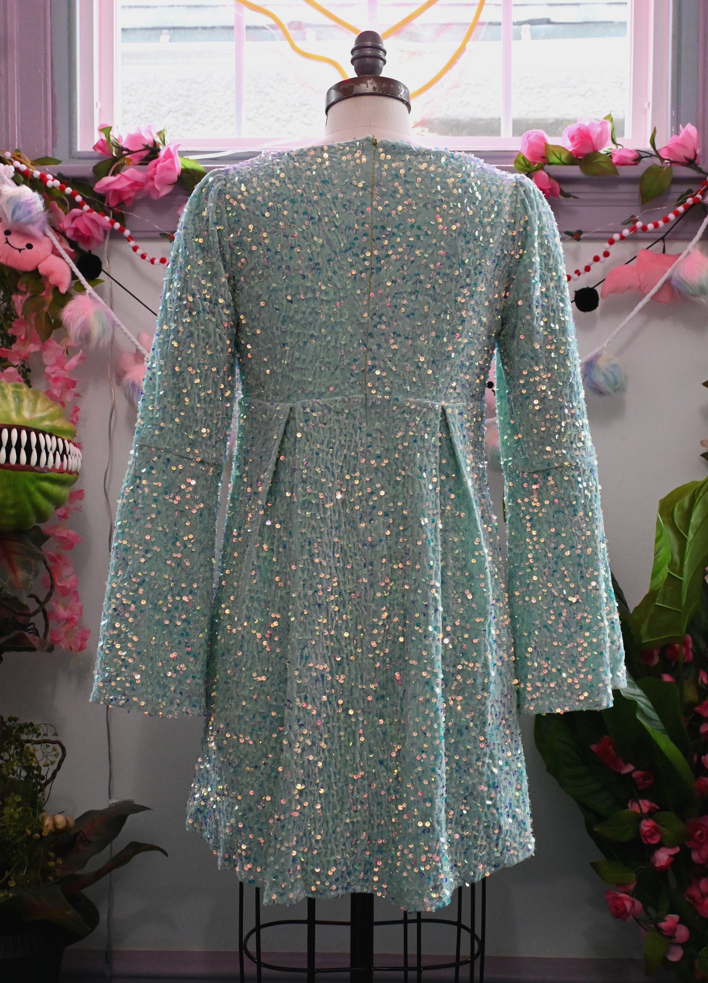 Back view of the Priscilla 60's inspired seafoam sequin velvet mini dress with bell sleeves and full lining.