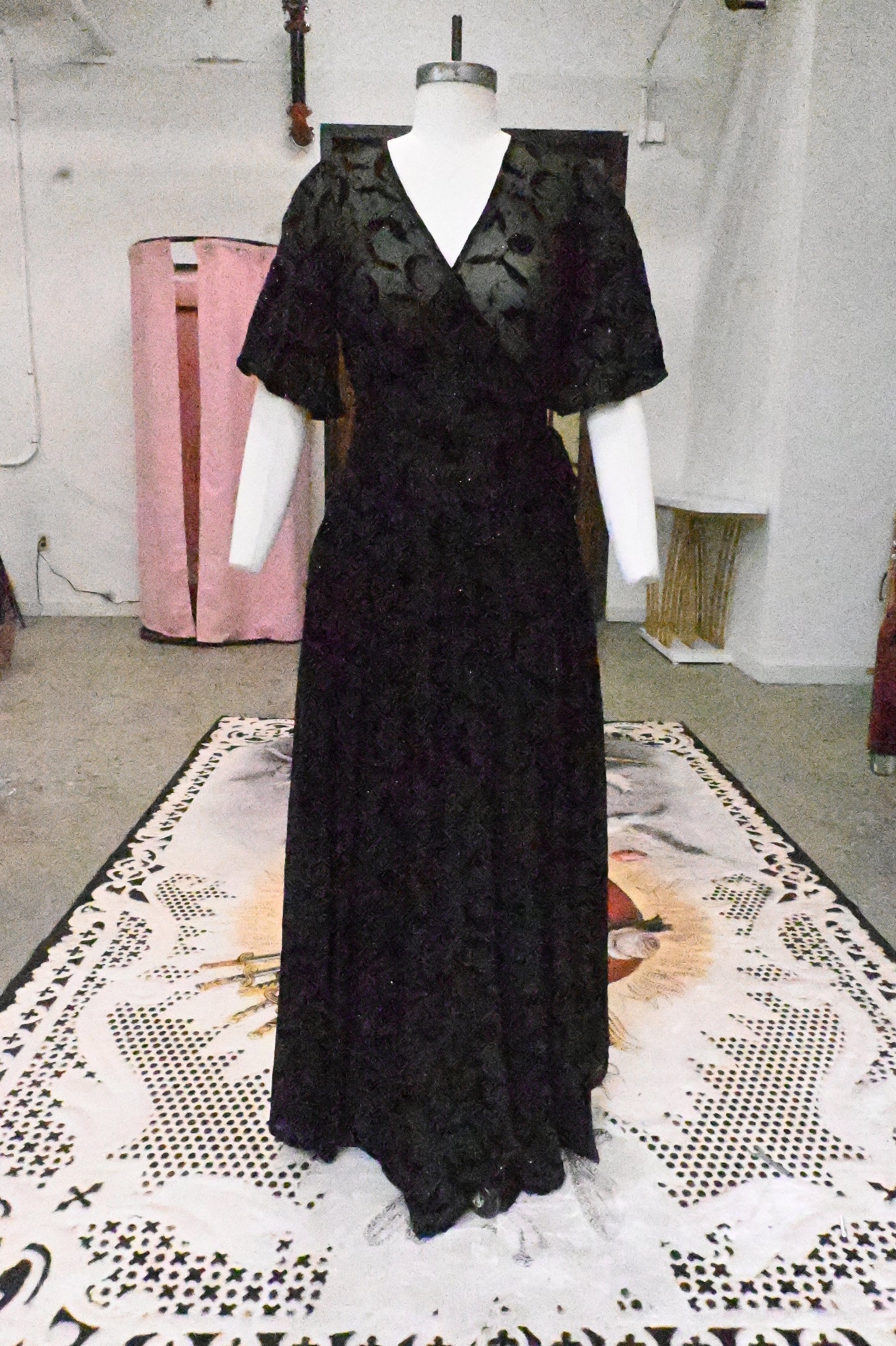 Lydia Wrap Dress in Queen of Halloween Black Flocked Mesh with bats, moons, stars, and glitter, featuring pockets and flutter sleeves.