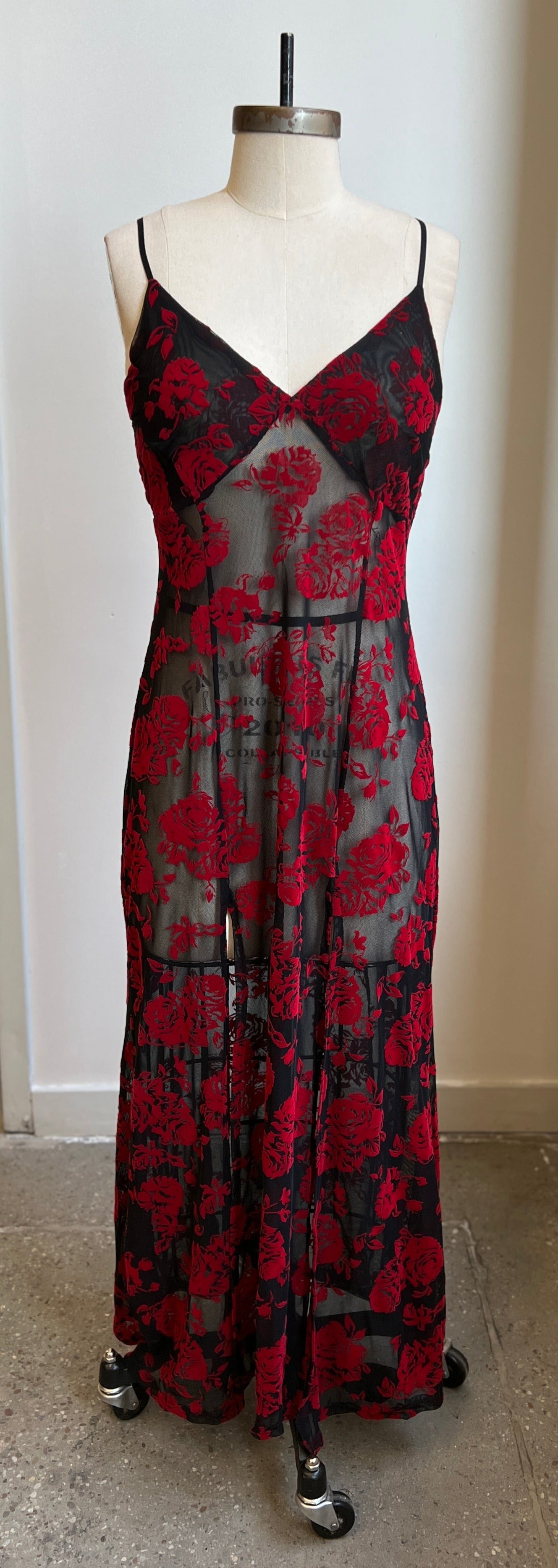 Elegant red rose flocked mesh slip dress with adjustable straps and dramatic thigh high slits, showcasing a stretchy sheer design.