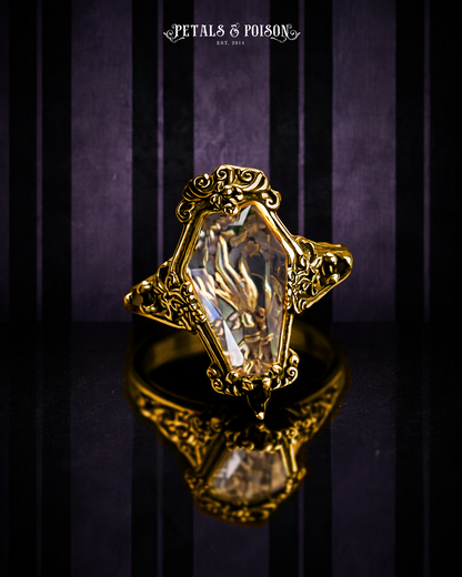 The GOLD "Mourning Hand” Glass Casket Ring by Petals and Poison