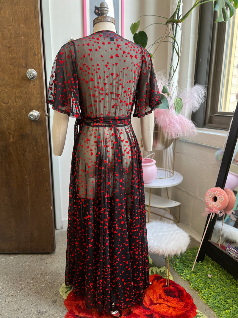 Back view of the Lydia Black Mesh wrap maxi dress featuring red hearts, perfect for Valentine's Day and has pockets.