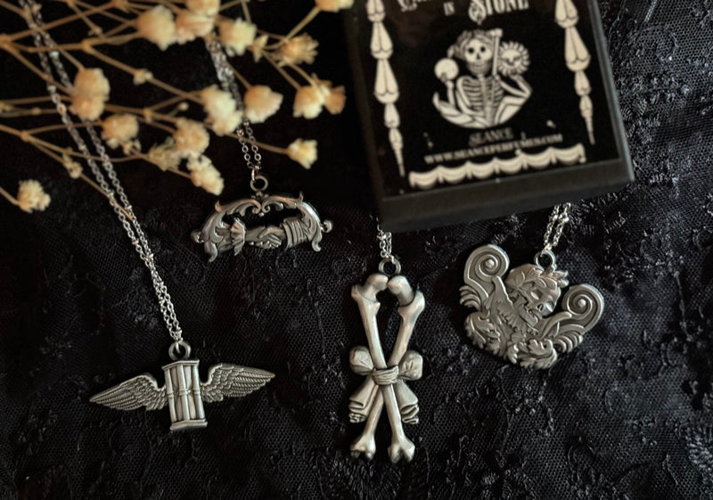 Carved In Stone- Hour Glass with Wings by Seance