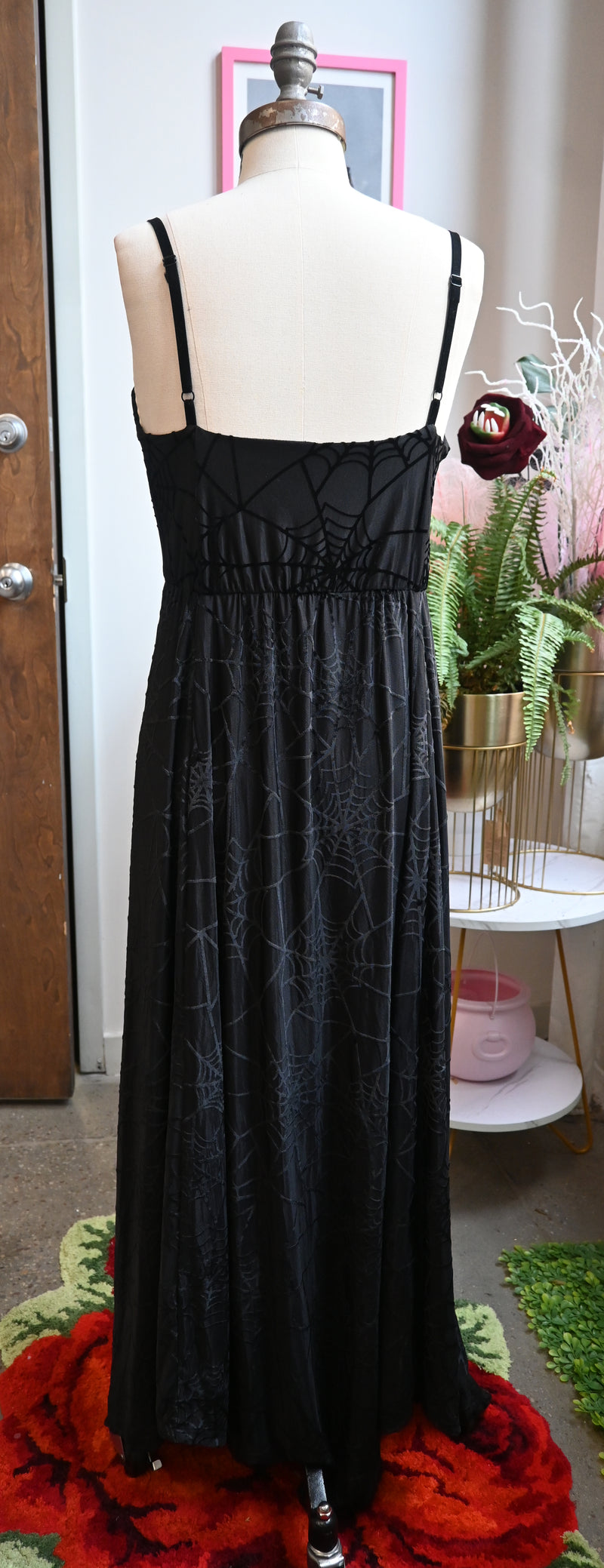 Back view of the black Willow Dress featuring spiderweb burnout, adjustable velvet straps, and asymmetrical hem.