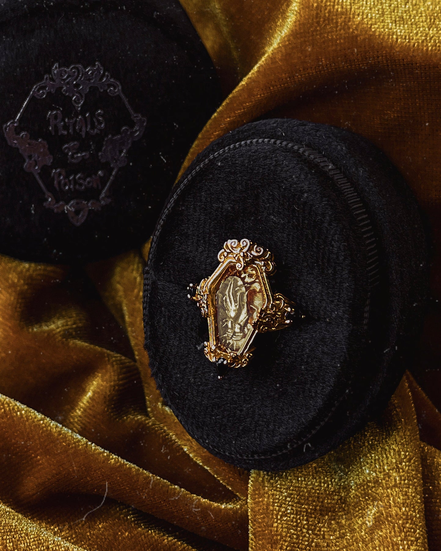 The GOLD "Mourning Hand” Glass Casket Ring by Petals and Poison