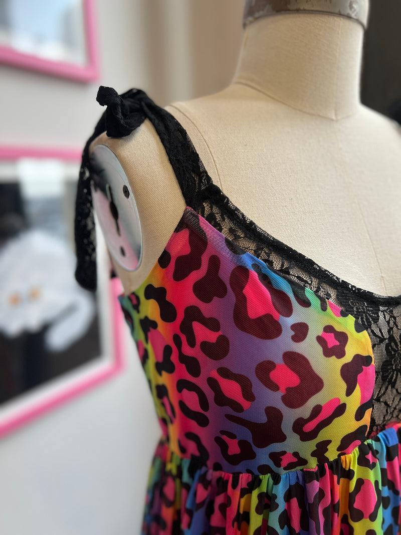 Close-up of the Josie Babydoll Dress in rainbow leopard mesh, featuring lace straps and a vibrant pattern for Pride.