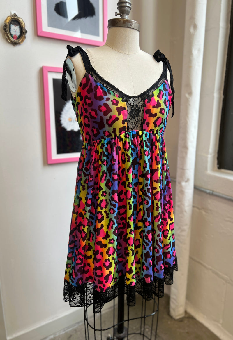 Josie Babydoll Dress in Rainbow Leopard Mesh, vibrant colors perfect for Pride celebration.