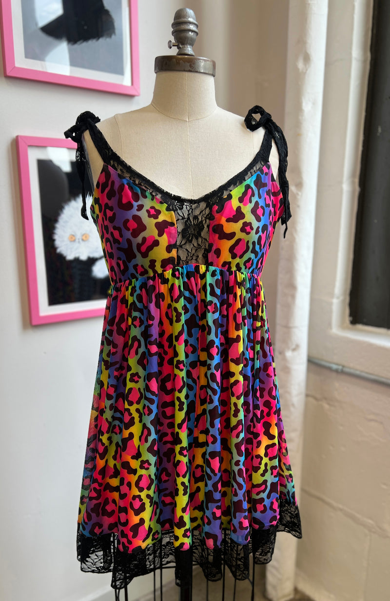 Josie Babydoll Dress in rainbow leopard mesh perfect for Pride, featuring colorful design and lace details.