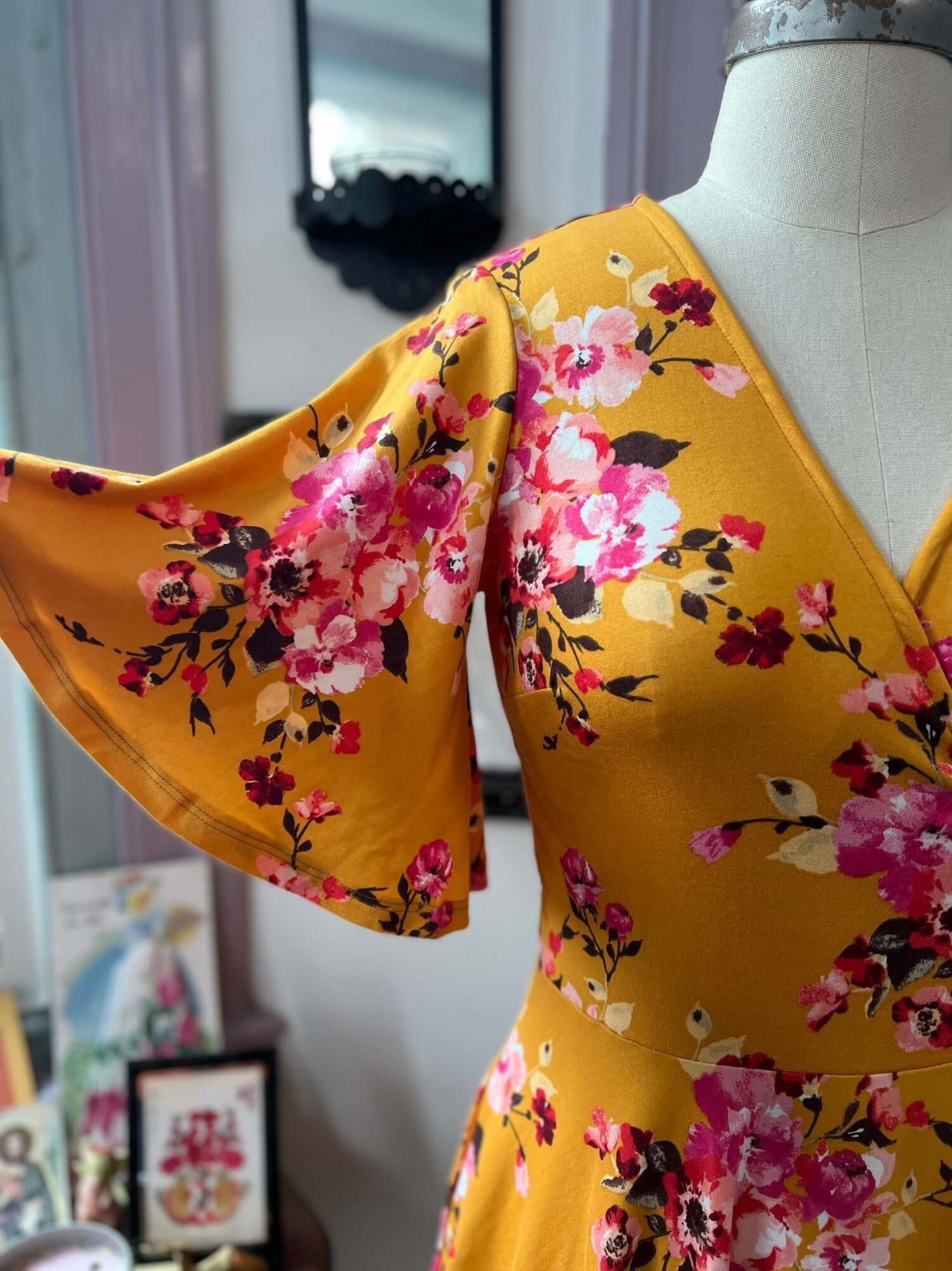 Aurora Wrap Dress in Goldenrod Floral sleeve